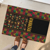 Black rubber doormat with bright Kwanzaa African pattern border and vertical 'KWANZAA'