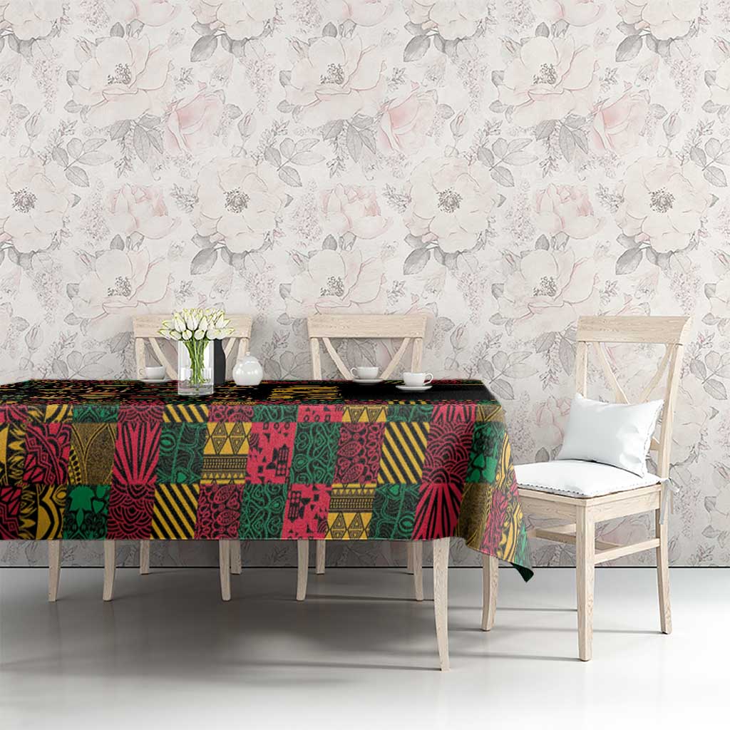Black tablecloth with vibrant multicolor African-inspired patchwork print on dining table