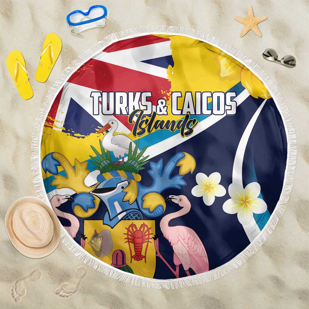 Round beach blanket with Turks & Caicos graphic, tropical animals, and white fringe edge