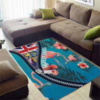 Turquoise area rug with flamingos and tropical leaves, Union Jack, and zigzag zipper edging