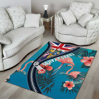 Turquoise area rug with flamingos, hibiscus flowers, and Union Jack zipper-style curved border