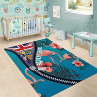 Turquoise area rug with flamingos, tropical flowers, and Union Jack along curved zipper border