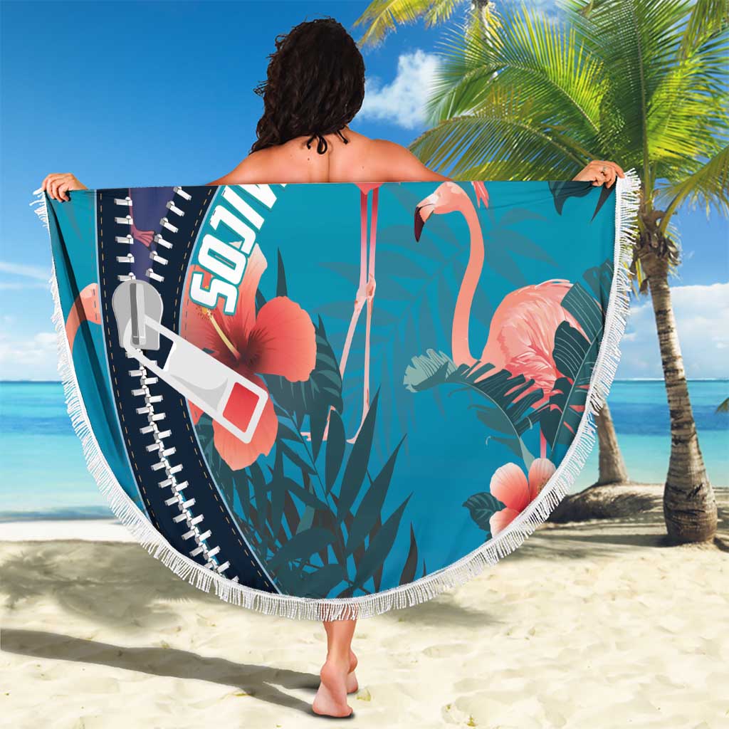 Round zippered beach blanket with turquoise flamingo and tropical print, fringed border