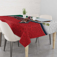 Mexico-themed tablecloth with red patterned center and white side, zipper-style trim on table