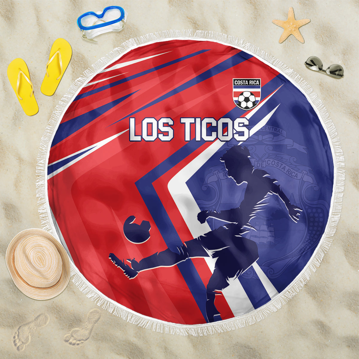 Round soccer beach blanket with red-and-navy stripes, Los Ticos text, and white fringe border