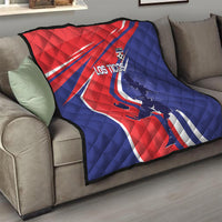 Red and blue quilt blanket on sofa, Los Ticos graphic with soccer figure