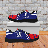 Blue and red soccer sneakers with black sole, front and side angle