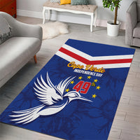 Blue area rug with flag stripes, eagle graphic, and Independence Day text