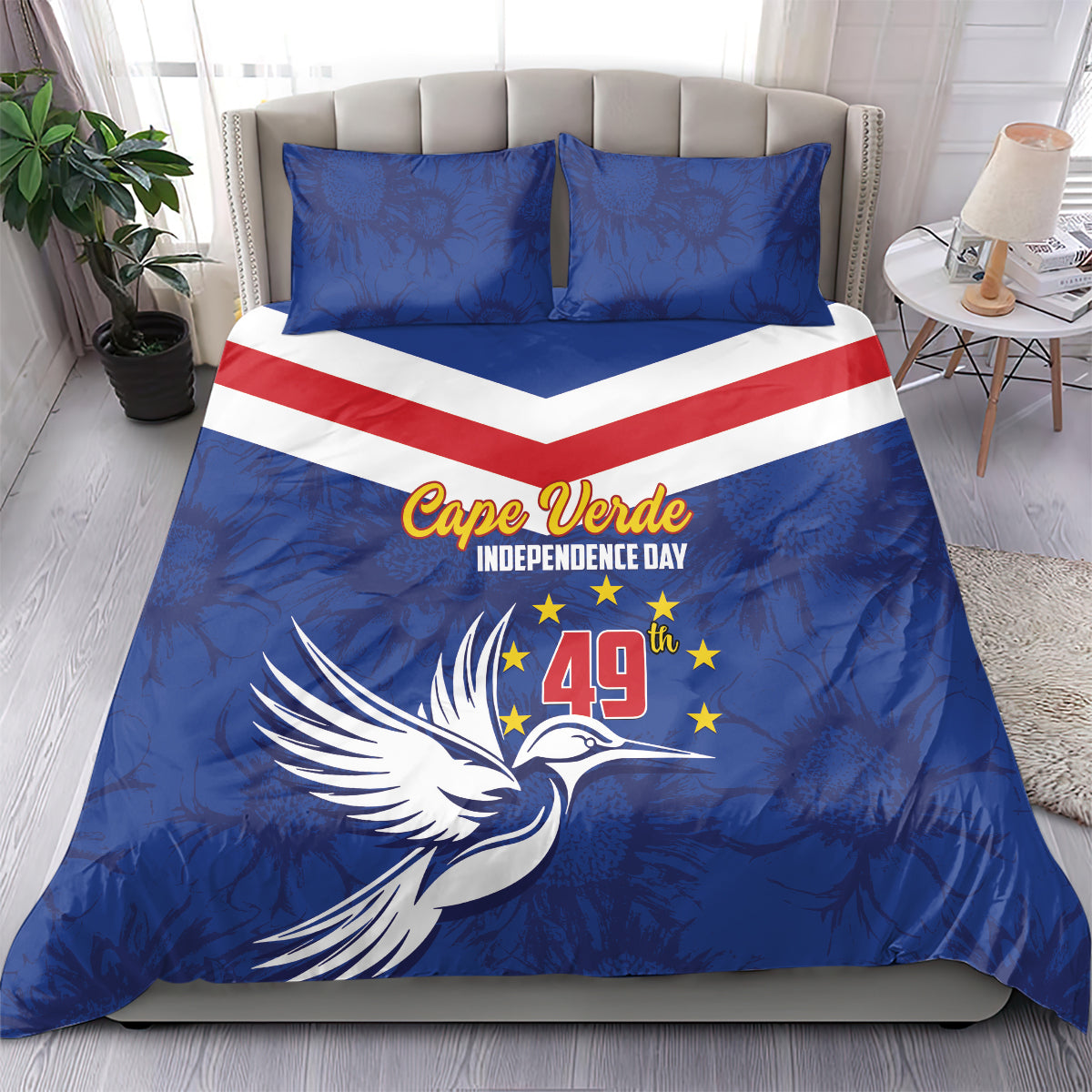 Blue duvet and pillowcases with red-and-white chevron stripe, dove artwork, and Cape Verde text