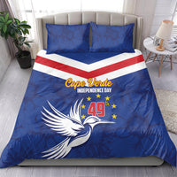Blue duvet and pillowcases with red-and-white chevron stripe, dove artwork, and Cape Verde text