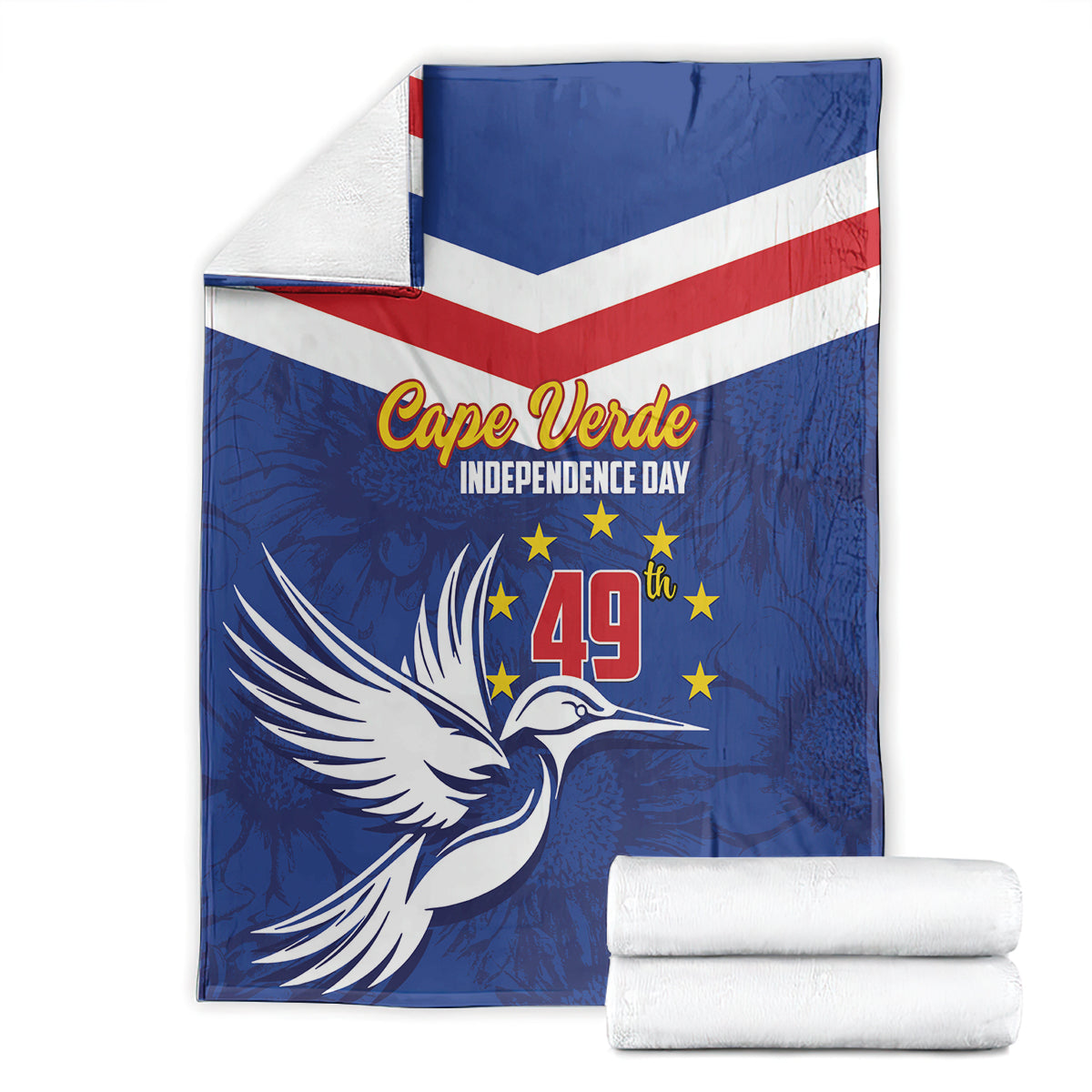 Blue independence day blanket with chevrons and dove graphic, folded with a white towel stack