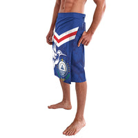 Blue printed lavalava shorts with Union Jack-style graphic and crest emblem, side view