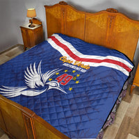 Blue Cape Verde Independence Day quilt on bed with flag stripe band and dove emblem