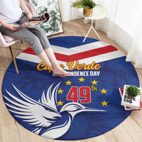 Blue round rug design with bird, yellow stars, red-and-white stripe, 49 and Cape Verde text