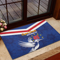 Blue rubber doormat with red-and-white chevrons, white bird, and Independence Day design