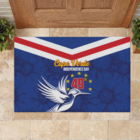 Blue rubber doormat with red-and-white chevrons, white bird, and “Cape Verde” emblem
