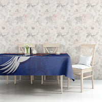 Blue tablecloth with dove-and-stripe pattern on a dining bench setup