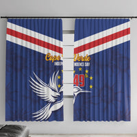 Blue window curtain panels showing Cape Verde Independence Day artwork with flag stripes