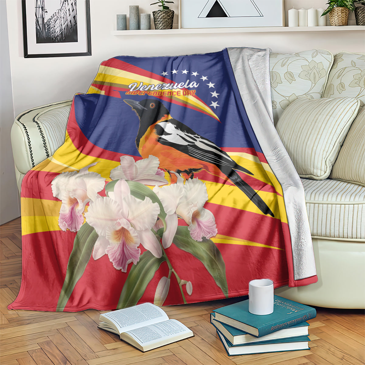 Blue and red throw blanket with Venezuela text, bird, orchids, and flag graphic