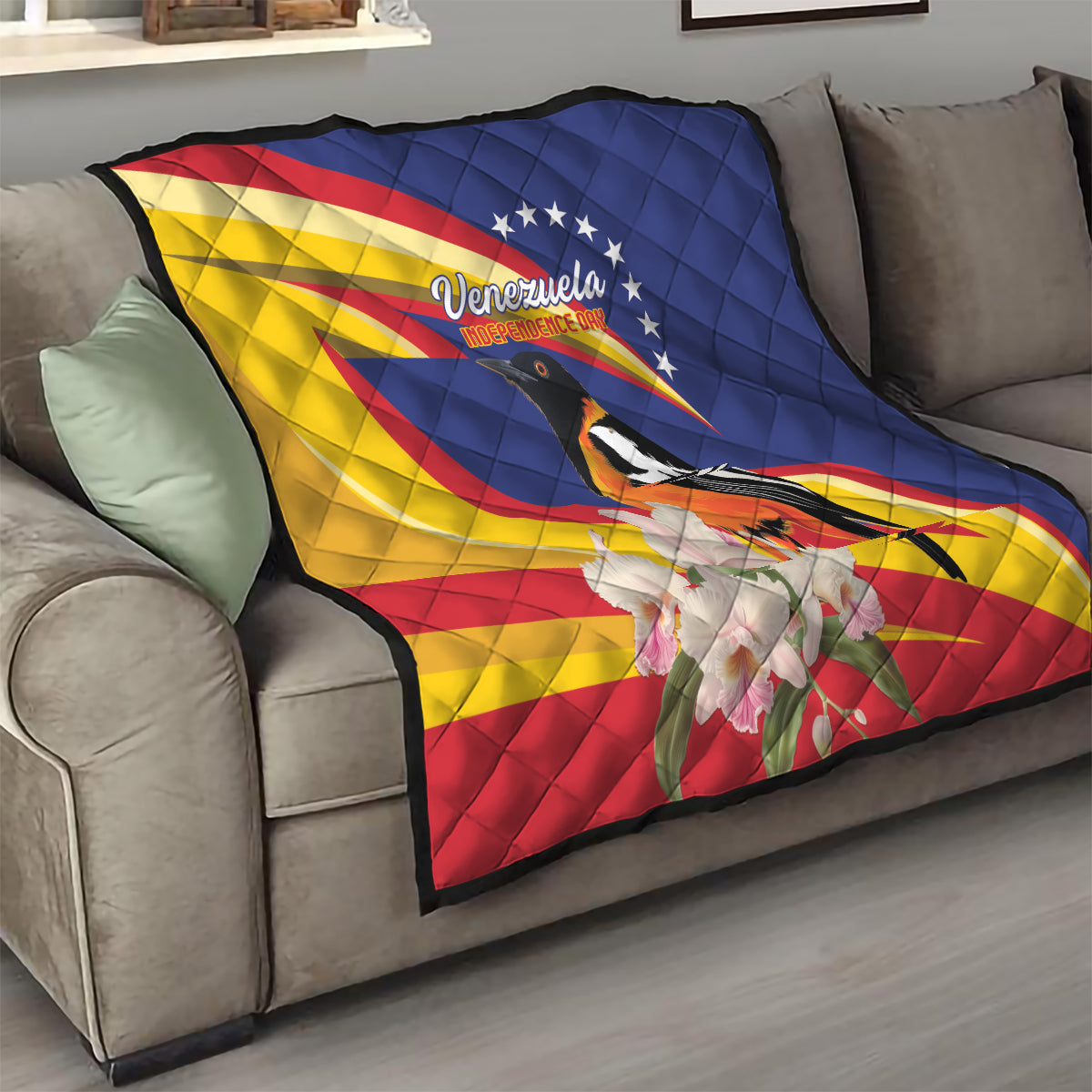 Venezuela Independence Day quilt on sofa, Venezuela flag colors with bird and white flowers