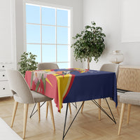 Blue tablecloth with red, yellow rays and floral bird centerpiece design