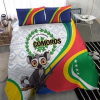 Comoros bedding set close-up: lemur artwork on flag-colored duvet and striped pillow shams