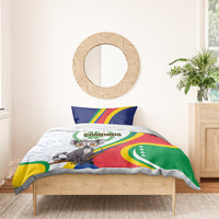Comoros bedding set: duvet with lemur emblem and flag colors, styled on a bed