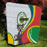 Comoros flag quilt on grass, quilted white base with colorful stripes and lemur
