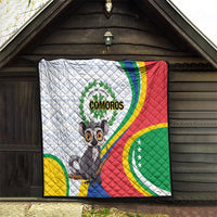 Comoros flag quilt hanging on a wall with quilted texture and centered cartoon lemur
