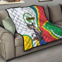 Comoros flag quilt draped over a sofa with cartoon lemur and green-yellow-red stripes