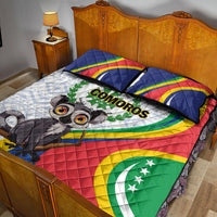 Quilt bed set laid on bed, showing Comoros emblem, lemur, and red yellow green flag colors