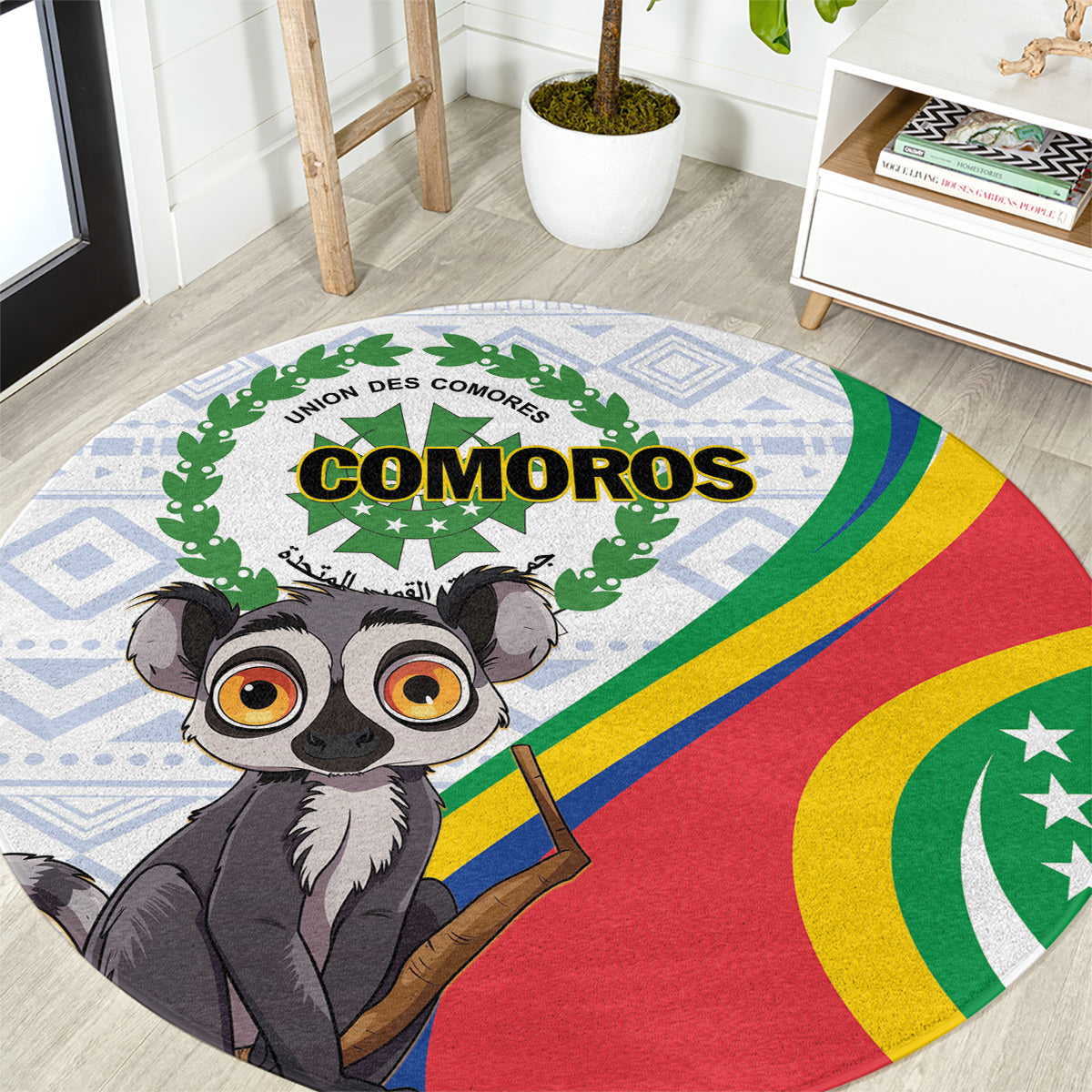 Round rug close-up with COMOROS text, cartoon lemur and rainbow flag stripes on blue pattern