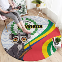 Round rug with cartoon lemur, COMOROS text, flag colors and blue geometric border
