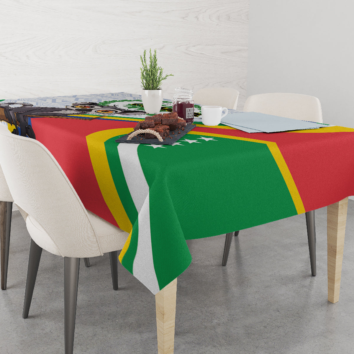 Comoros-themed tablecloth draped over table with bold red, green, and yellow stripes