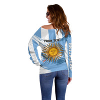 Off-shoulder striped sweater with sun graphic and vertical sleeve print, side view