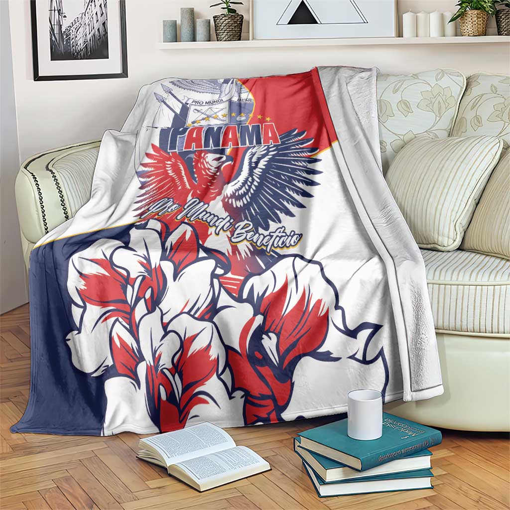Red, white, and blue eagle and flower graphic blanket spread over bed with books