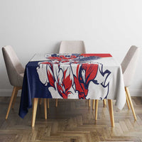 Red, blue, and white eagle motif tablecloth covering a square dining table.