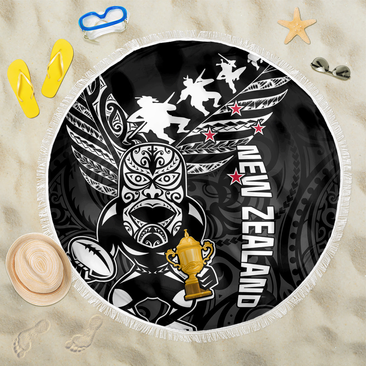 Round black beach blanket with white tribal rugby graphic, trophy, and white fringe edge