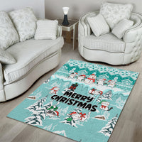 Turquoise Christmas area rug with centered 'Merry Christmas' and cartoon cat snowmen