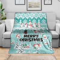 Turquoise Merry Christmas cat blanket draped over a sofa