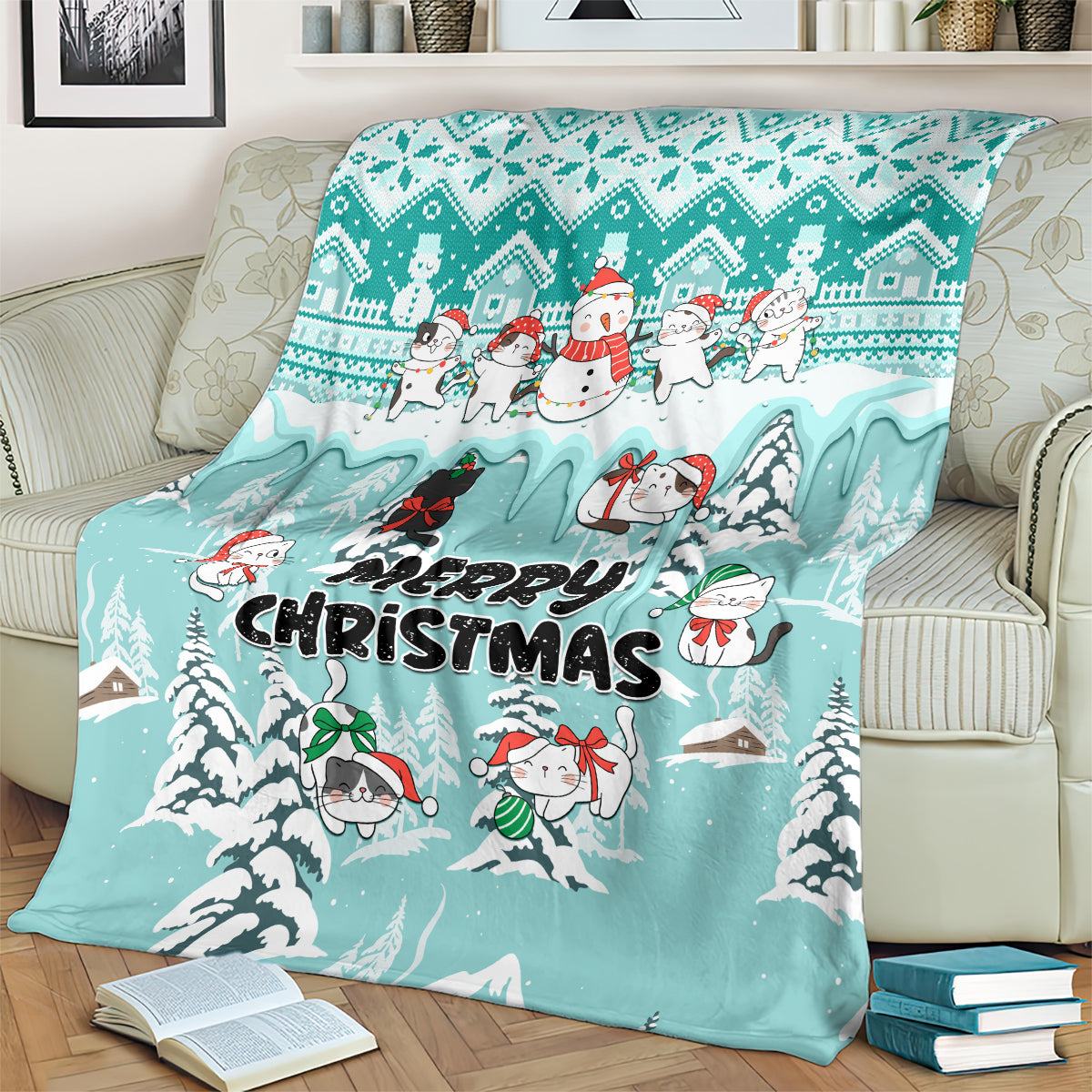Turquoise Christmas cat blanket showing “Merry Christmas” and festive characters