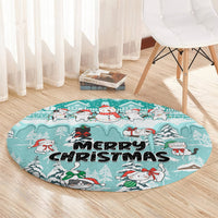 Turquoise round Christmas cat rug with snowman and 'Merry Christmas' lettering, wide view