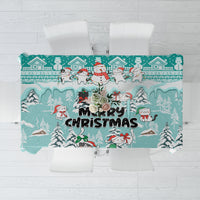 Turquoise Christmas tablecloth with cats and snowman, Merry Christmas text and winter houses