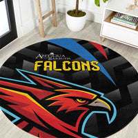 Black round carpet with bold Falcons eagle graphic in blue, red, and yellow