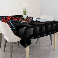 Black cricket tablecloth with Falcons emblem and geometric pattern across tabletop