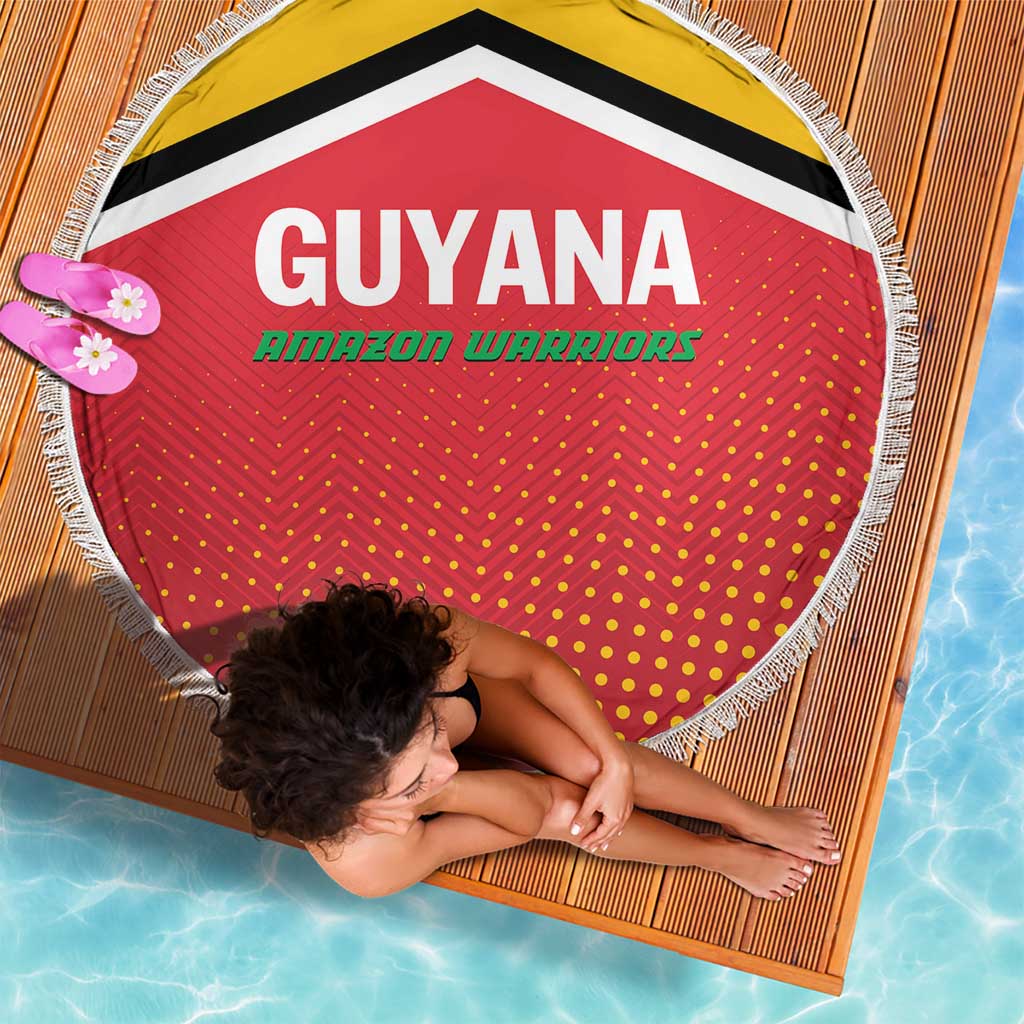 Red circular beach blanket with Guyana Amazon Warriors text, yellow border, dot pattern, fringe