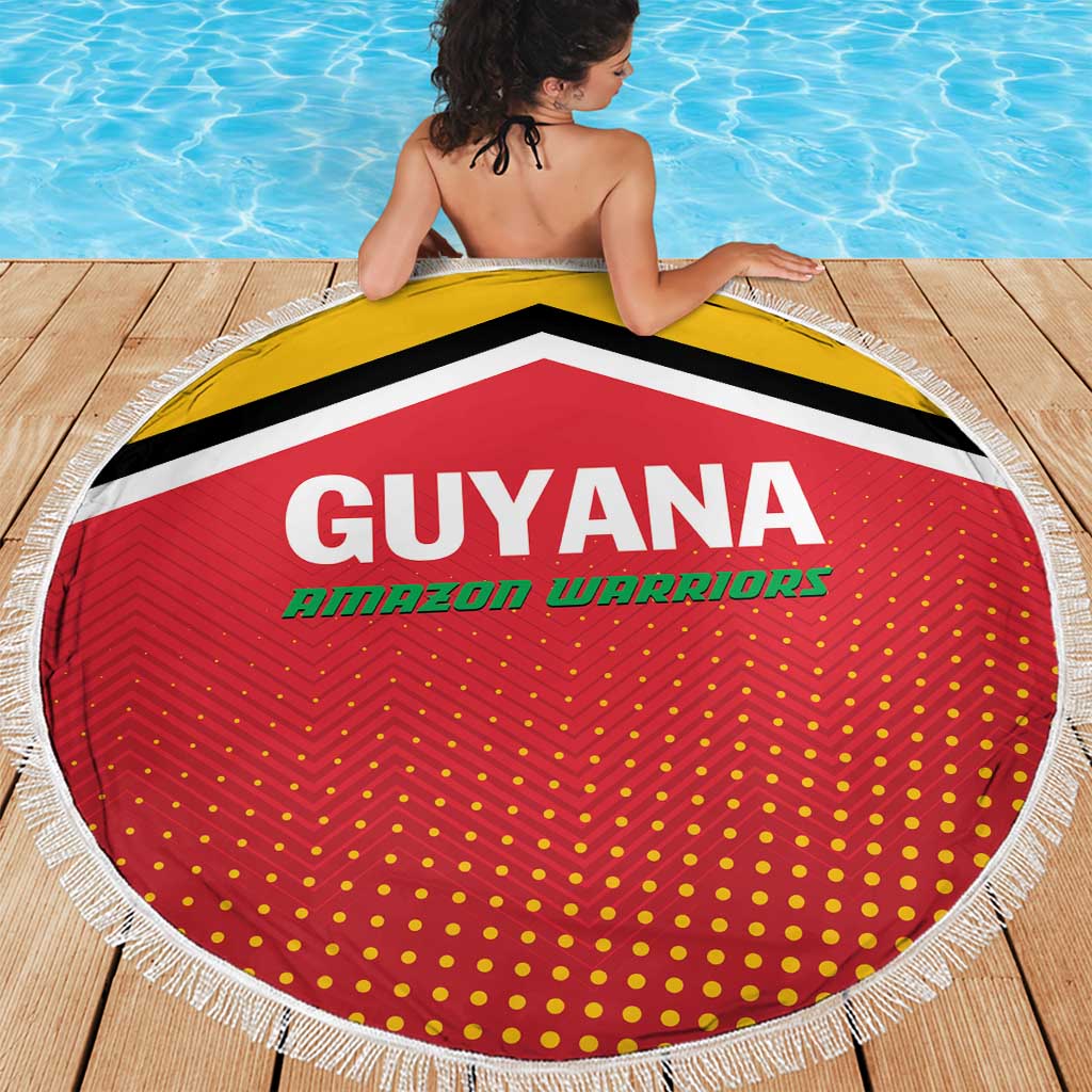 Round red beach blanket with Guyana Amazon Warriors logo, black/yellow bands, white fringe