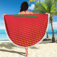 Red round beach blanket with Guyana Amazon Warriors design, white fringe edge, striped bands
