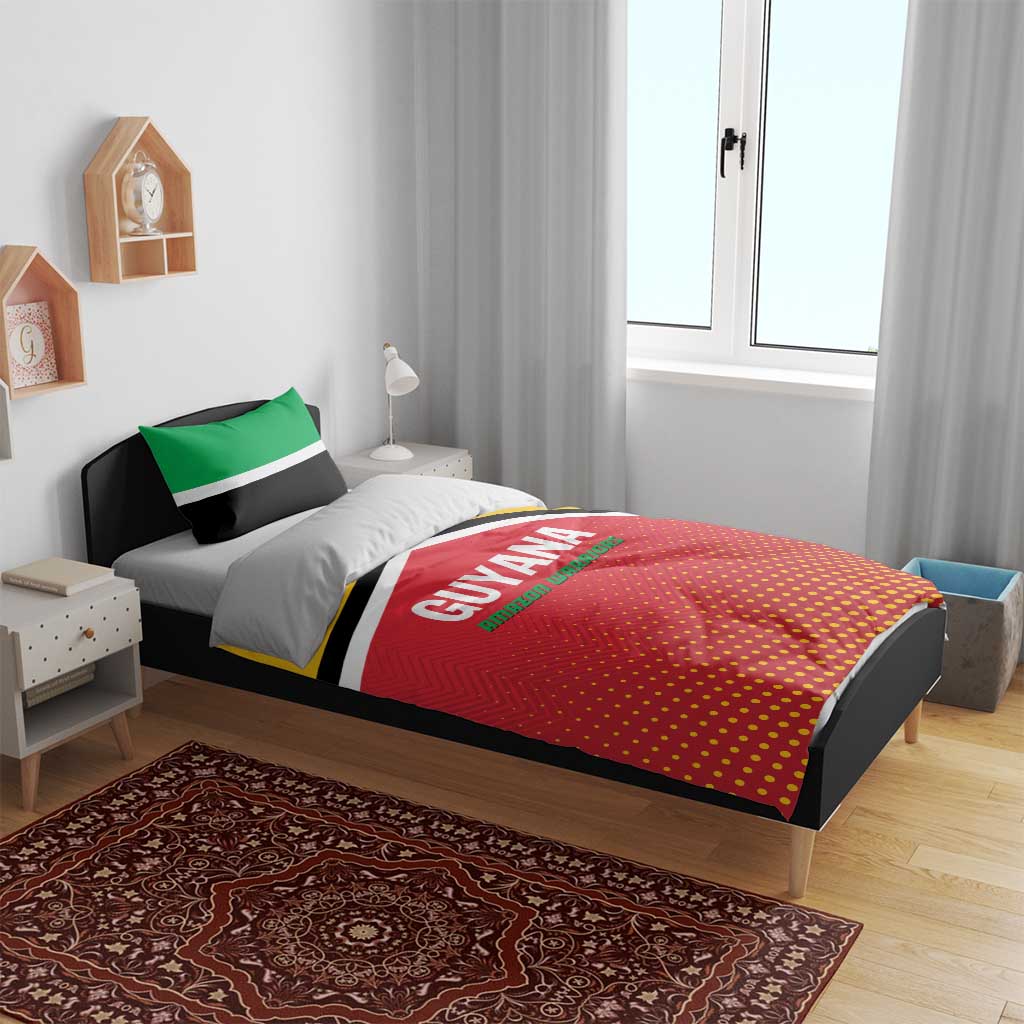 Guyana-themed duvet and pillow set on bed frame, red dotted duvet with green stripe