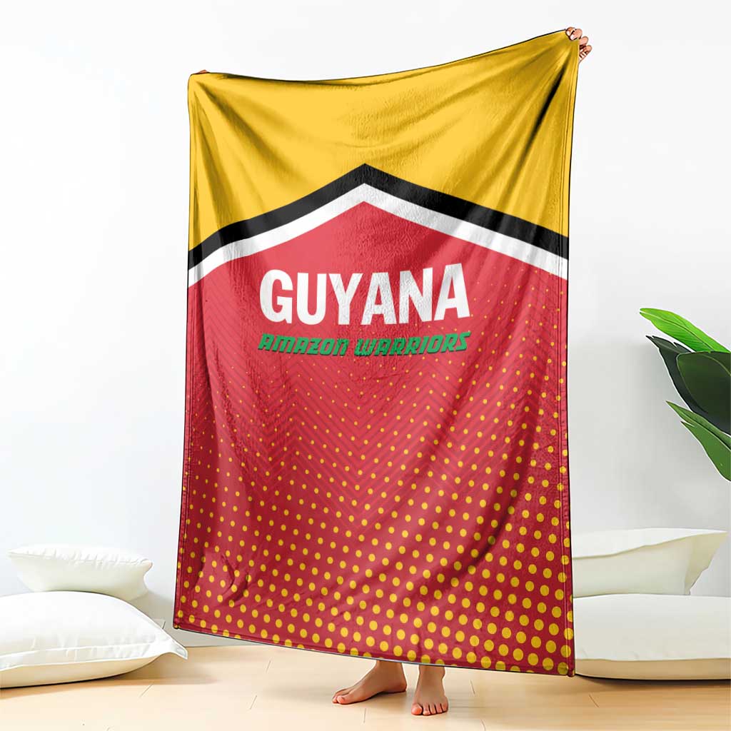 Guyana cricket blanket draped vertically, yellow top and red dotted field with chevron border.